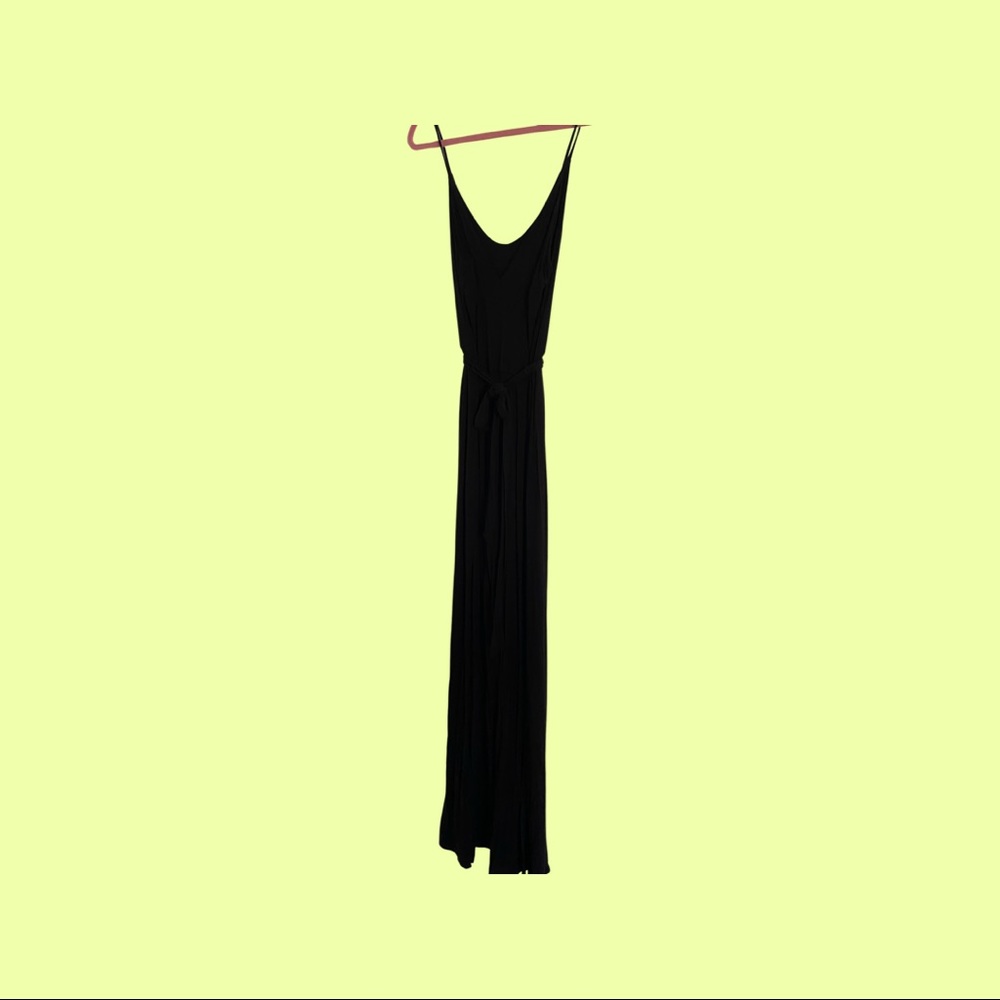 Lulu’s stretchy jersey knit black jumpsuit with slits on legs. Sexy